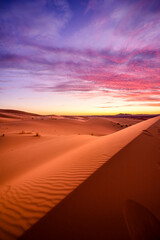 Naklejka na ściany i meble Dramtic and colorful sunrise at the Sahara desert: Earth's Largest Hot Desert