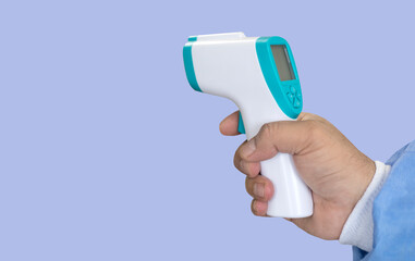 hand holding a body thermometer