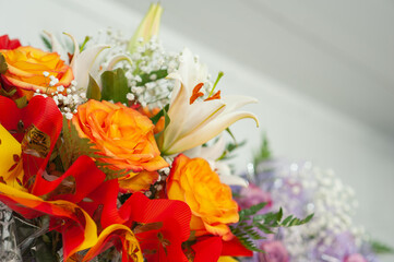 Colorful flower bouquet on the shelf. Flower business. Multi-colored bouquet. Selective focus. Macro photo.
