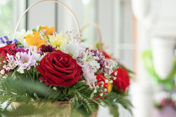 Colorful flower bouquet on the shelf. Flower business. Multi-colored bouquet. Selective focus. Macro photo.