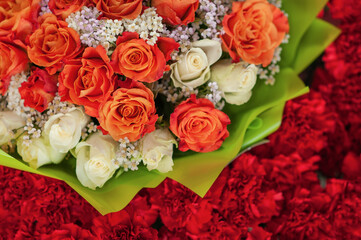 Colorful flower bouquet on the shelf. Flower business. Multi-colored bouquet. Selective focus. Macro photo.