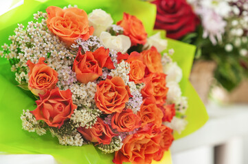 Colorful flower bouquet on the shelf. Flower business. Multi-colored bouquet. Selective focus. Macro photo.