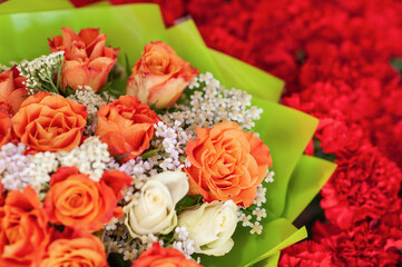 Colorful flower bouquet on the shelf. Flower business. Multi-colored bouquet. Selective focus. Macro photo.