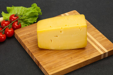 Hard yellow tasty cheese brick