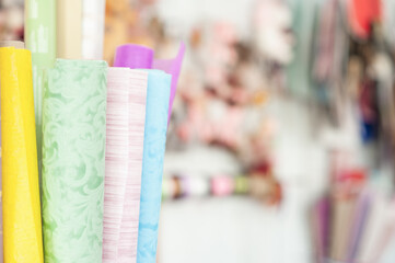 Packing paper of different colors from the florist. wrapping paper. Packaging for gifts and flowers. Flower shop. Small business. In the store.