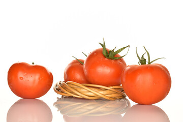 Fresh ripe, juicy, organic tomato, close-up, on a white background.