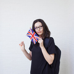 young woman with the flag of great Britain. English language learning,