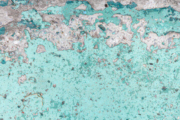 Obraz na płótnie Canvas Texture concrete wall with sheltered blue and green paint closeup