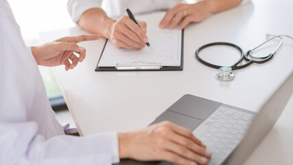 Fototapeta premium Doctor and patient consults or discussing about diagnosis