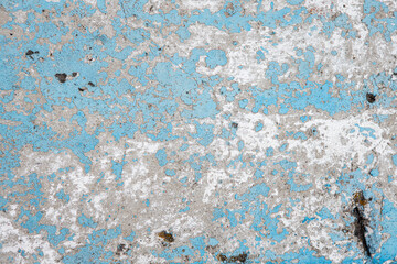 Fototapeta na wymiar Texture concrete wall with sheltered blue and green paint closeup