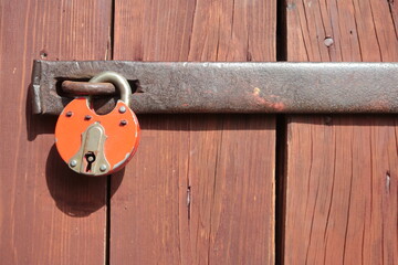 Old padlock on wooden doors