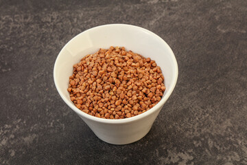 Raw buсkwheat cereal in the bowl