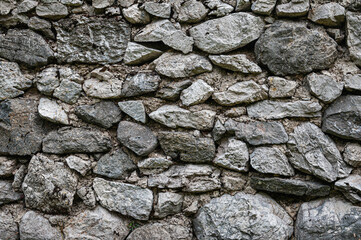 Grey stone brick blocks texture. Medieval castle wall slates background	
