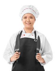 Beautiful Asian chef with knives on white background