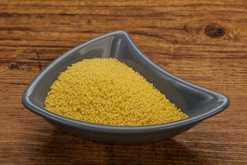 Raw cous cous heap in the bowl
