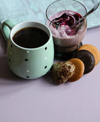 still life with a curd dessert, a cup of coffee and sweets