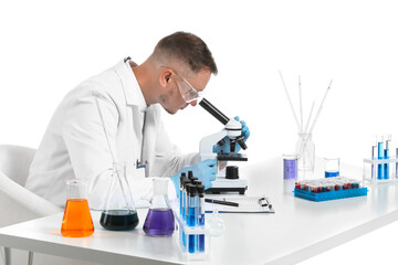 Fototapeta premium Scientist working with microscope on white background