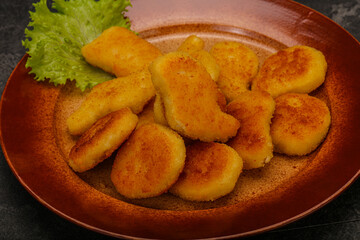 Fried chicken nuggets served salad leaves