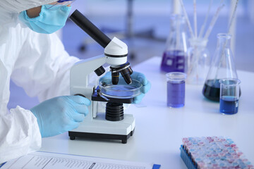 Scientist working with sample in laboratory
