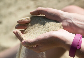 sand flows through your fingers like time