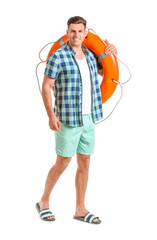 Young man with lifebuoy on white background