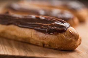 french eclairs with choclate top closeup