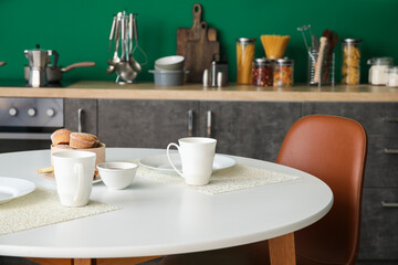 Table set in stylish modern kitchen
