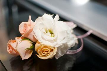 Buttonhole flower in the groom's buttonhole in light colors