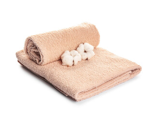 Fototapeta na wymiar Cotton flowers and soft towels on white background