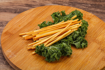 Chechel cheese sticks over board