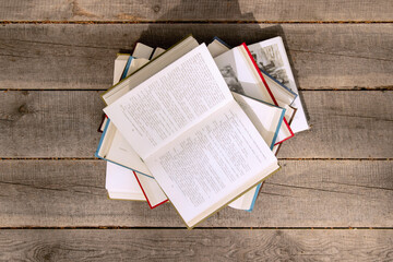 Obraz premium Open books are stacked on top of each other. Open knowledge accessible to all.