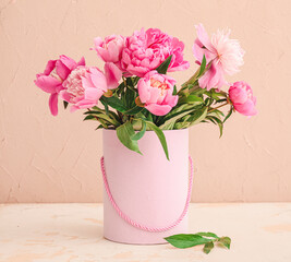 Beautiful peony flowers in vase on table