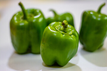 Fresh green capsicum or bell pepper isolated on a white background
