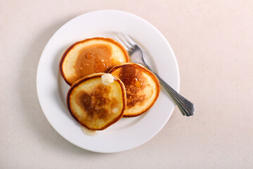 Pancakes with syrup and butter served