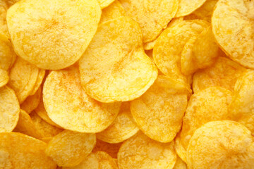 Golden potato chips background with copy space for text