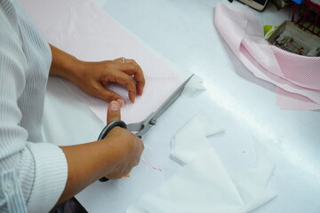 Asian woman designer boutique scissors
