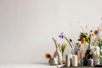 Tuinposter Large group of various handmade ceramic, clay and glass vases with flowers © pressmaster