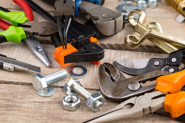 Fototapeta premium Different tools on the old background.