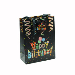 Black birthday bag with a colorful print, studio shot, isolated on white background