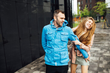Naklejka premium beautiful happy couple of lovers have fun in the city