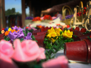 Tiny artificial flowers in pots at Dilli Haat, New Delhi, India