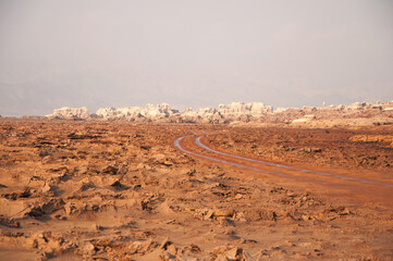 Early morning landscape with warm light at sunrise in salt desert near Dallol volcano, the hottest place year-round on the planet located in Afar region, Danakil Depression, Northern Ethiopia