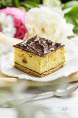 Piece of homemade cheesecake with chocolate glaze