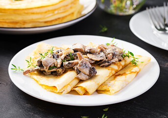 Pancakes with mushrooms.  Homemade baking. Maslenitsa week. Maslenitsa.