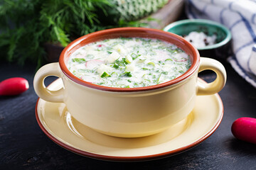 Okroshka. Cold summer soup with yogurt and vegetables in bowl.
