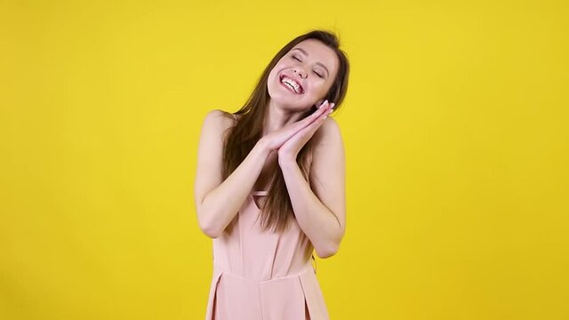 Woman with brunette hair in blouse shouting yes and clapping hands with happiness, emotionally rejoicing in victory success, winner. Success and achievement concept