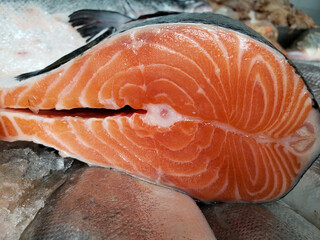 Close up on sliced ​​salmon in fishmonger, seafood