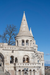 Fototapeta na wymiar White high-pitched stone towers of Fisherman's Bastion on Buda castle in Budapest