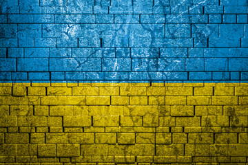 National flag of Ukraine on brick  wall background.The concept of national pride and symbol of the...