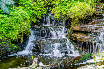 Waterfalls with cascading water levels In the midst of nature With green trees looking fresh
